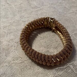 Elegant Gold-Toned Bracelet; signature reads Panera
